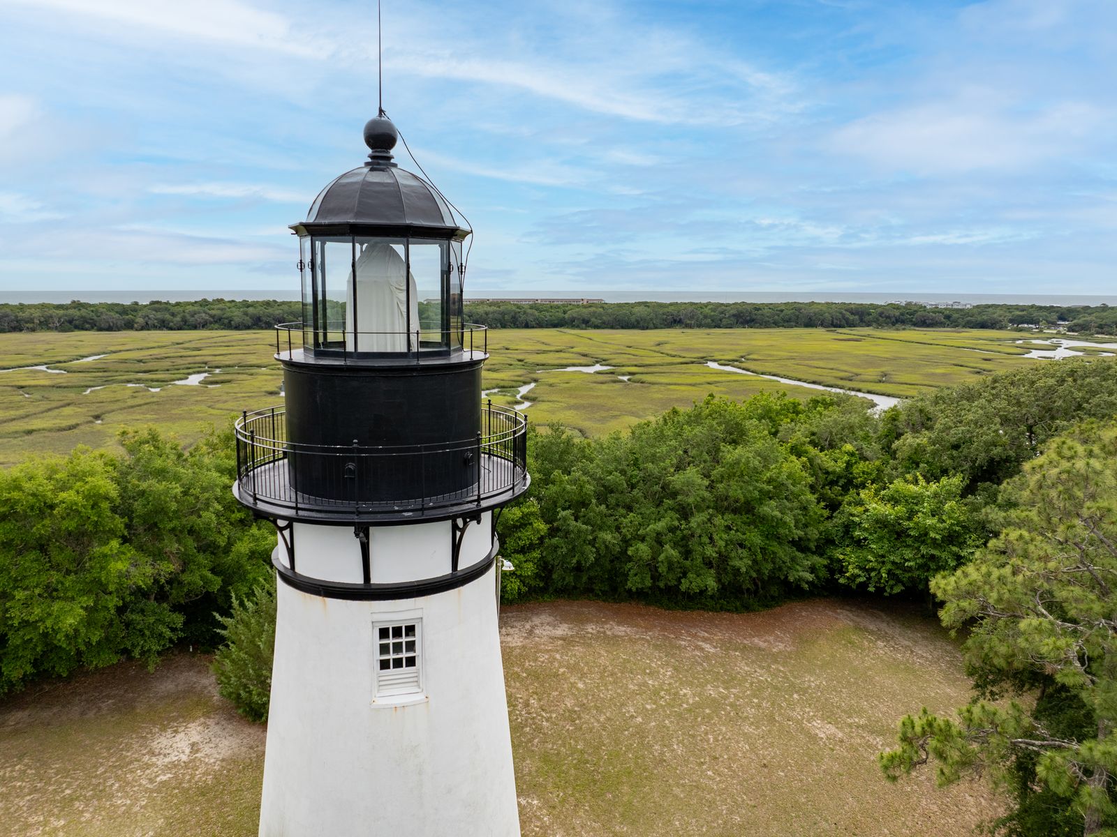 amelia lighthouse close Amelia Island lighthouse with tidal marsh and Atlantic Ocean in the background