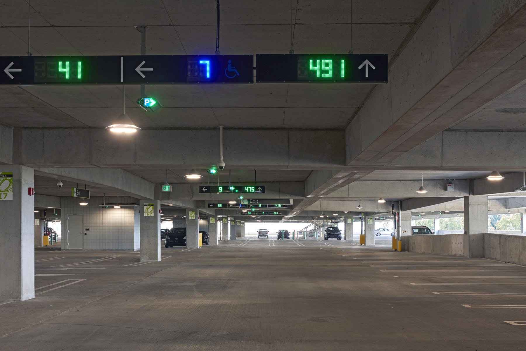 atl-interior-apgs Interior of ATL West Deck showing parking spaces and a sign displaying real-time space availability