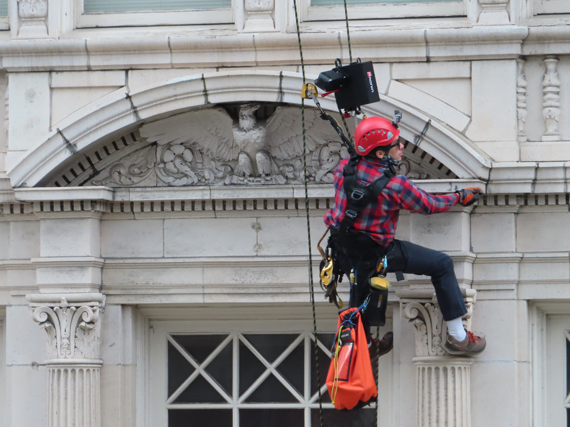 Rope access survey of a building with ornate terra cotta facade